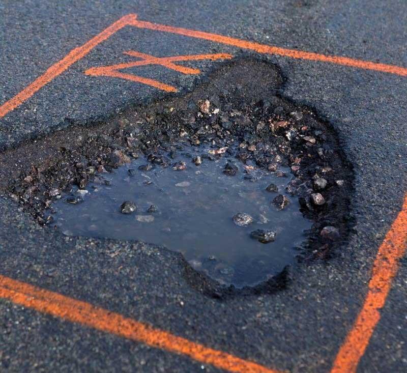 pothole marked with paint